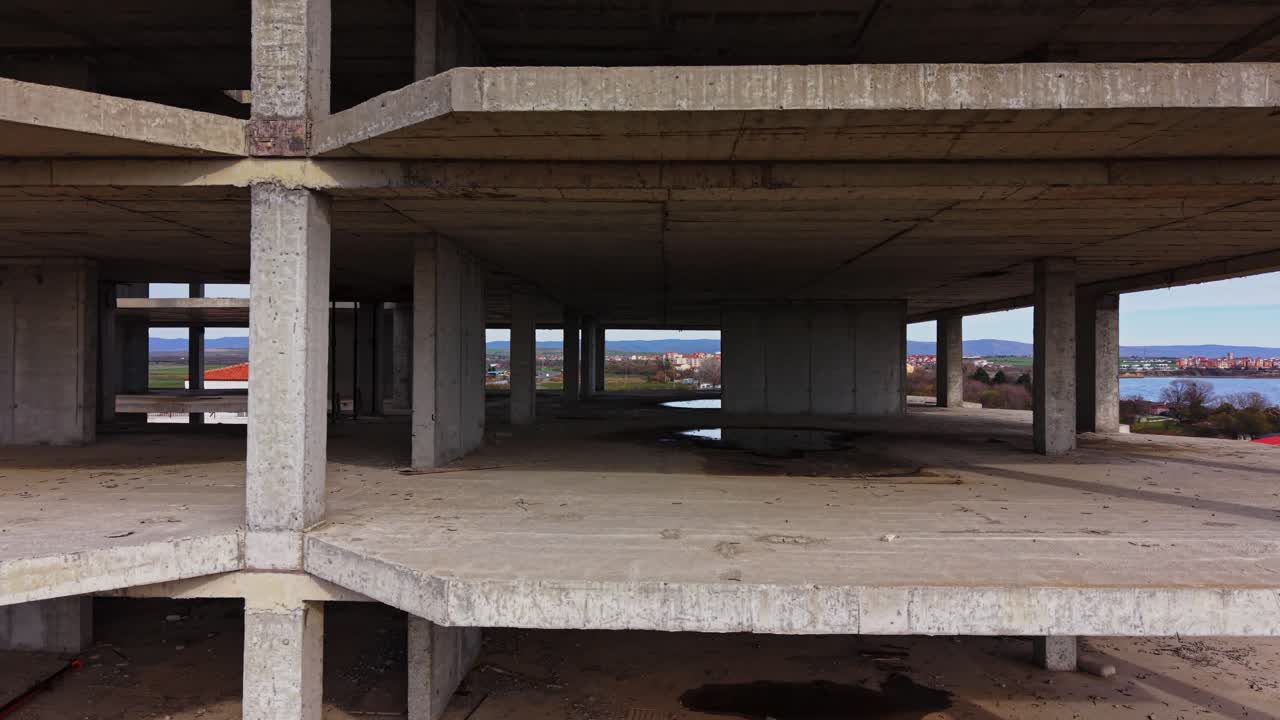 Construction site of a large building with a scenic background in daylight