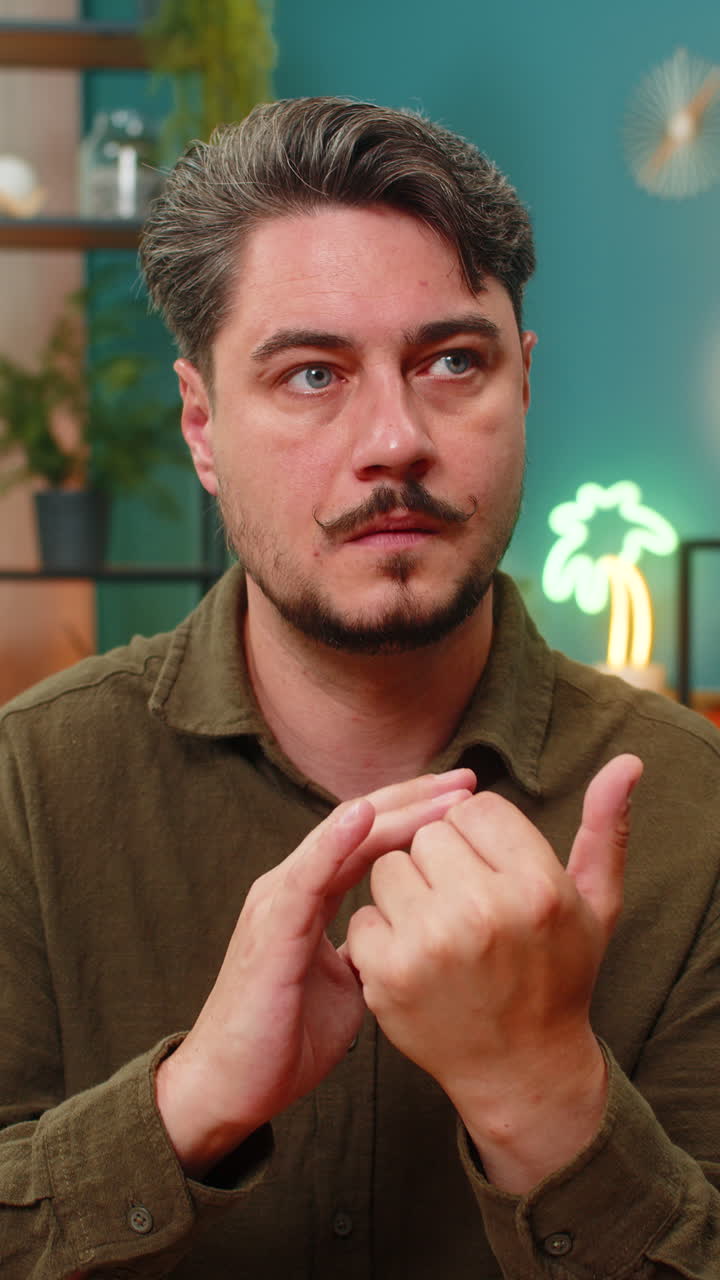 Middleaged man counting fingers thinking planning tasks pondering key life choices thoughtful focus