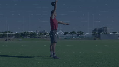 man swinging kettlebell on turf field, overlaying animated heart icon and fitness chart