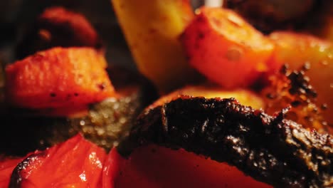 vibrant close-up of grilled veggies - cauliflower, red bell peppers, zucchini, carrots - seasoned with herbs and spices