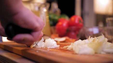 the cook cuts the onion close-up. cutting onion