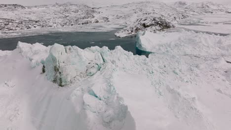 drone over sea and ice of ilulissat icefjord