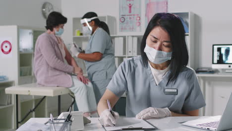 female doctor working on laptop