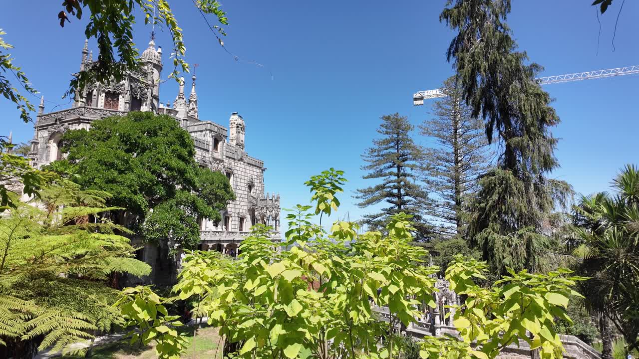 Stone staircase in Sintra's Quinta da Regaleira, Portugal with rustic walls and bright light at the end