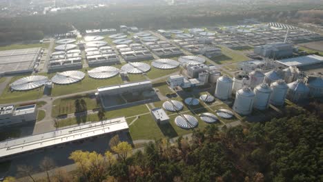 aerial orbit over a huge biological wastewater treatment plant on evening