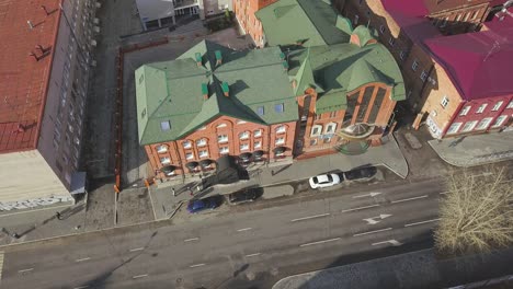 aerial view of city street with buildings and cars