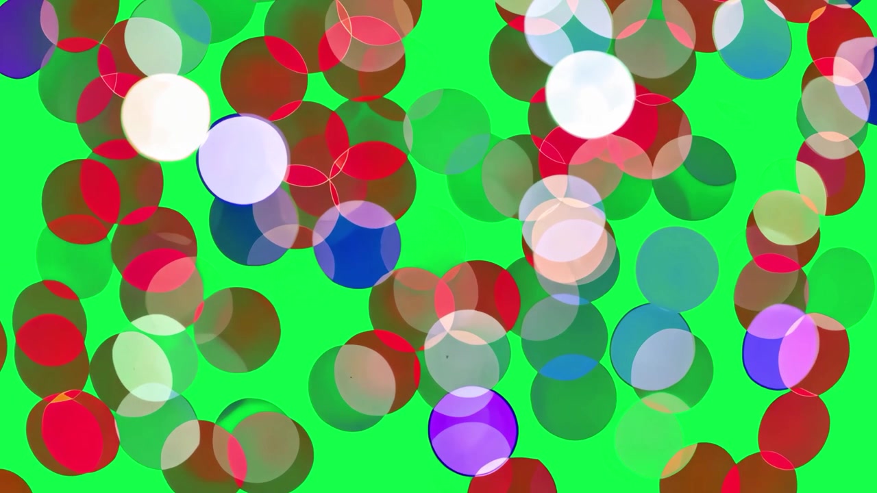 Cerchi bokeh astratti e colorati che fluttuano su uno sfondo verde