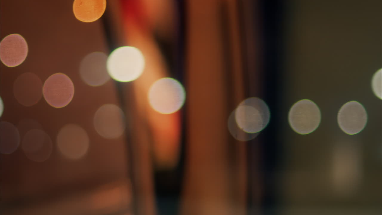 Close up of the window of a moving train with a blurry view