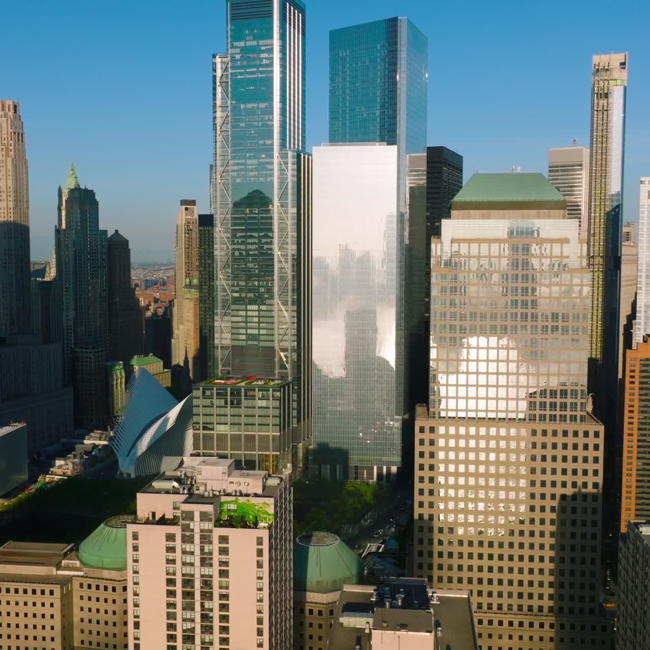 Diverse buildings and skyscrapers of Lower Manhattan Financial District in the sun light. New York city architecture at the backdrop of blue clear sky