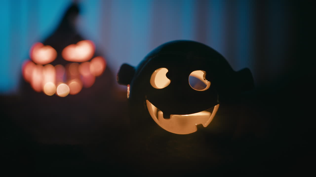 Little Halloween monster smiles in silhouette at night