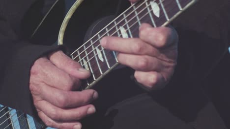 close-up of a guitarist playing an electric guitar