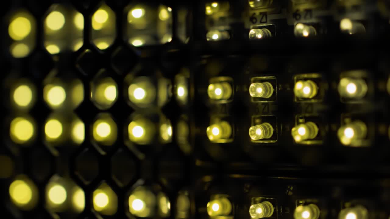 Close-up View of Illuminated LED Lights Highlighting a Honeycomb Grid Pattern, Capturing the Intricacies of Light and Technology in a Modern Design