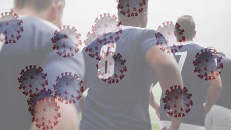 animación de la interfaz digital con la célula del virus covid 19 sobre jugadores de rugby