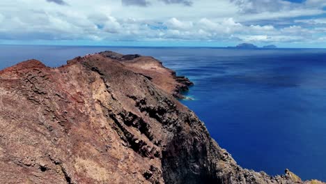 Aerial-View-Of-Rugged-Cliff-On-The-Atlantic-Ocean-Revealing-Stunning-Viewpoint-Behind