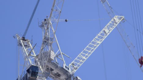 cranes at construction site in manchester city uk