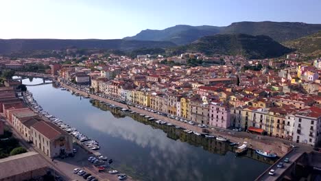 bosa, sardinia, italy - drone aerial shot hovering over the river temo and two stone bridges. a perfect italian landscape