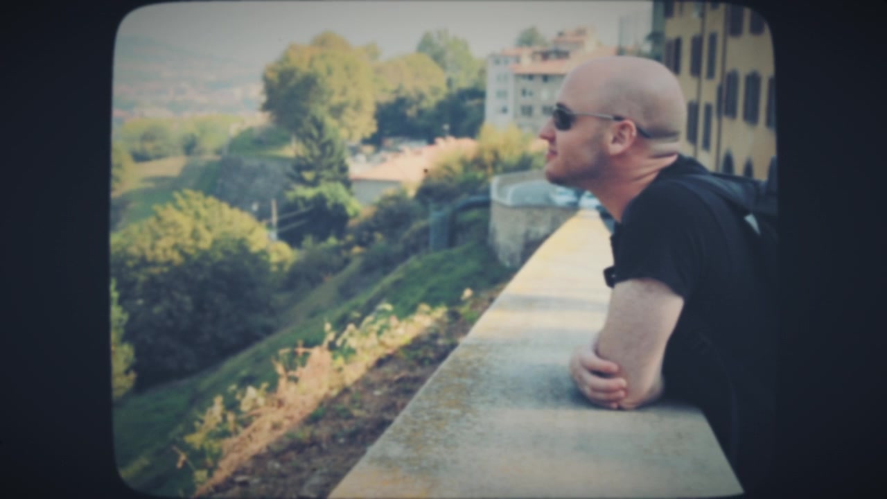 A young man enjoying old city view