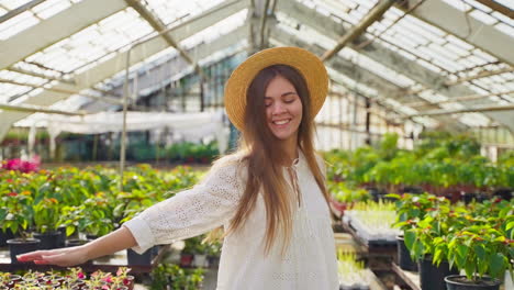 woman enjoying time in a greenhouse