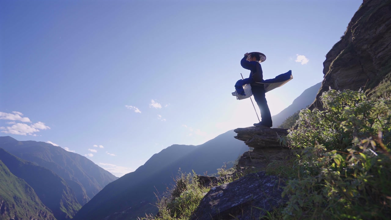 Epic Wuxia Swordsman Drinks Wine on Snow-Capped Mountain Peak, Ancient Chinese Wanderer Hiking Through Himalayan Valley at Sunrise
