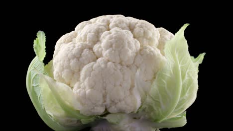 video of rotating cauliflower on black background