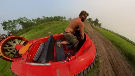 360 camera view of man operating a hover craft across grassy field