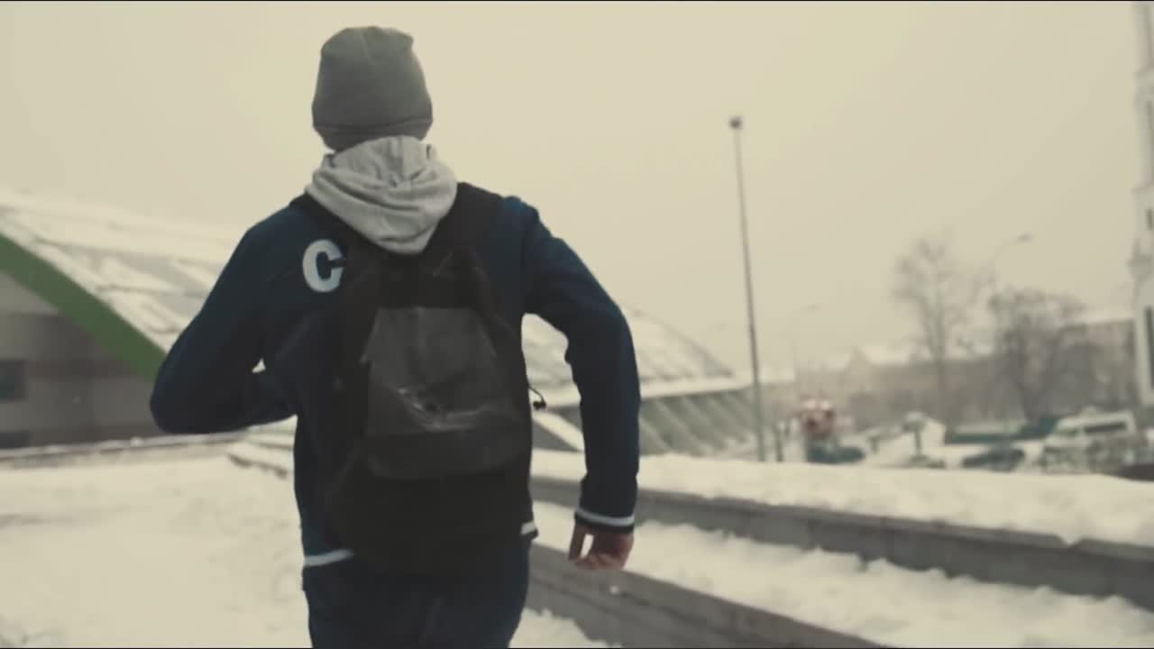 Man walking in snowy city