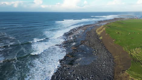 rough sea waves breaking against rocky irish coast, doolin in ireland