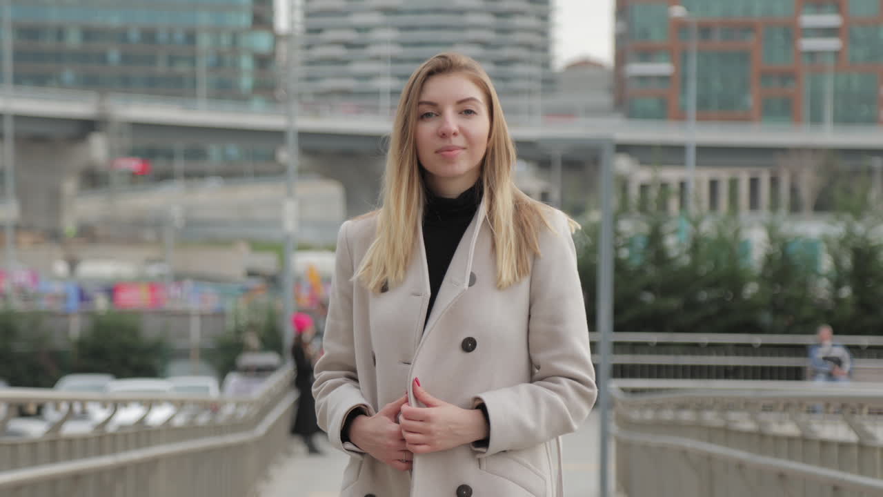 Woman in a Beige Coat in the City