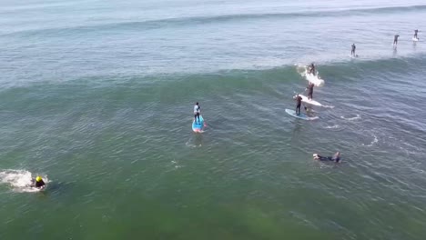 surfer foils up on a wave, skillfully riding and gliding above the water, capturing the thrill of the moment