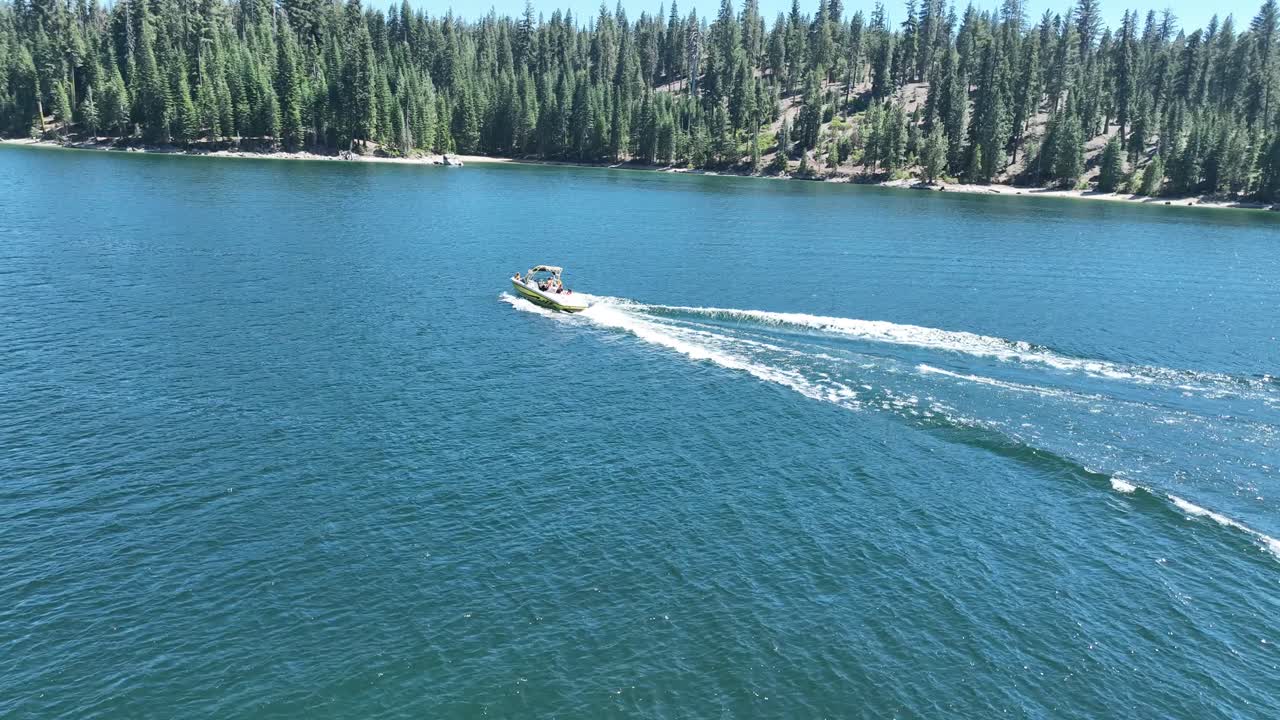 speed boat drives through lake
