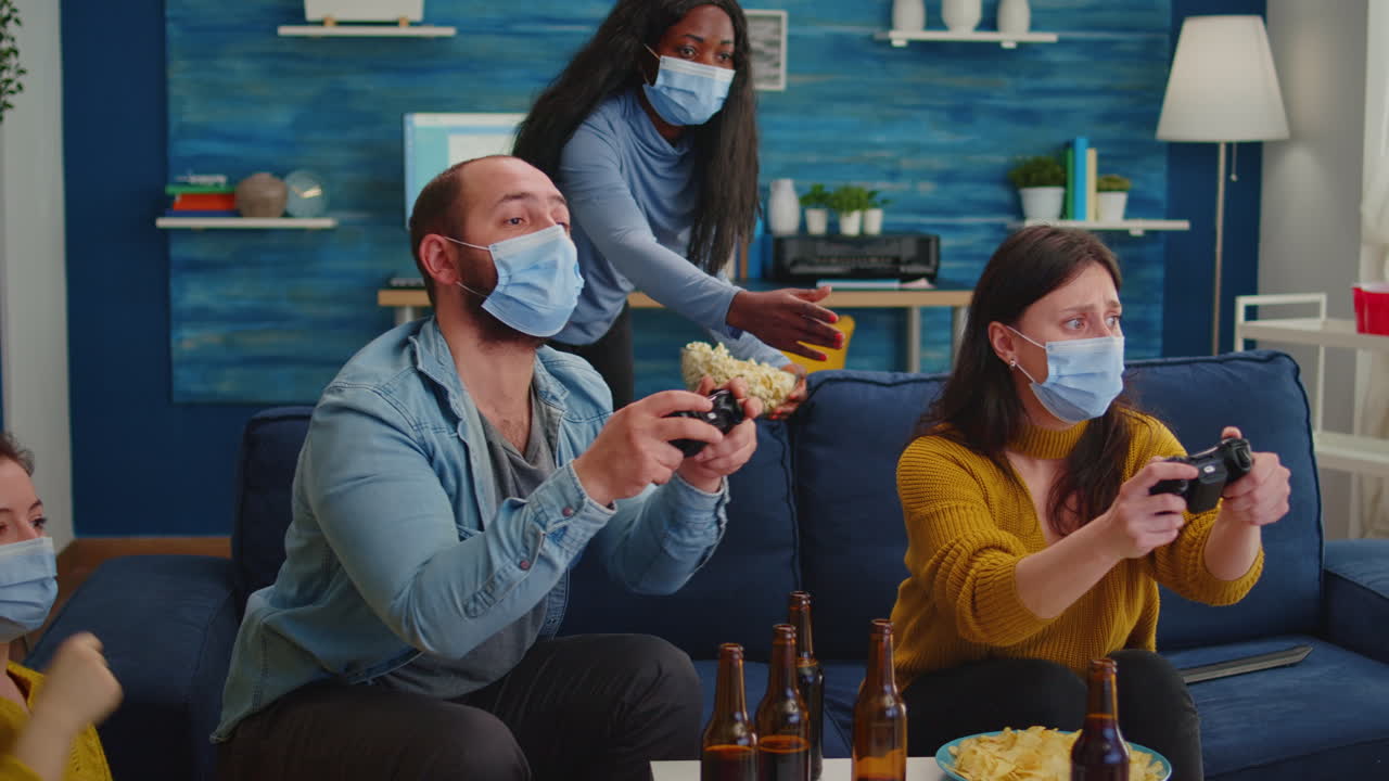 Multiethnic friends celebrating victory playing video games