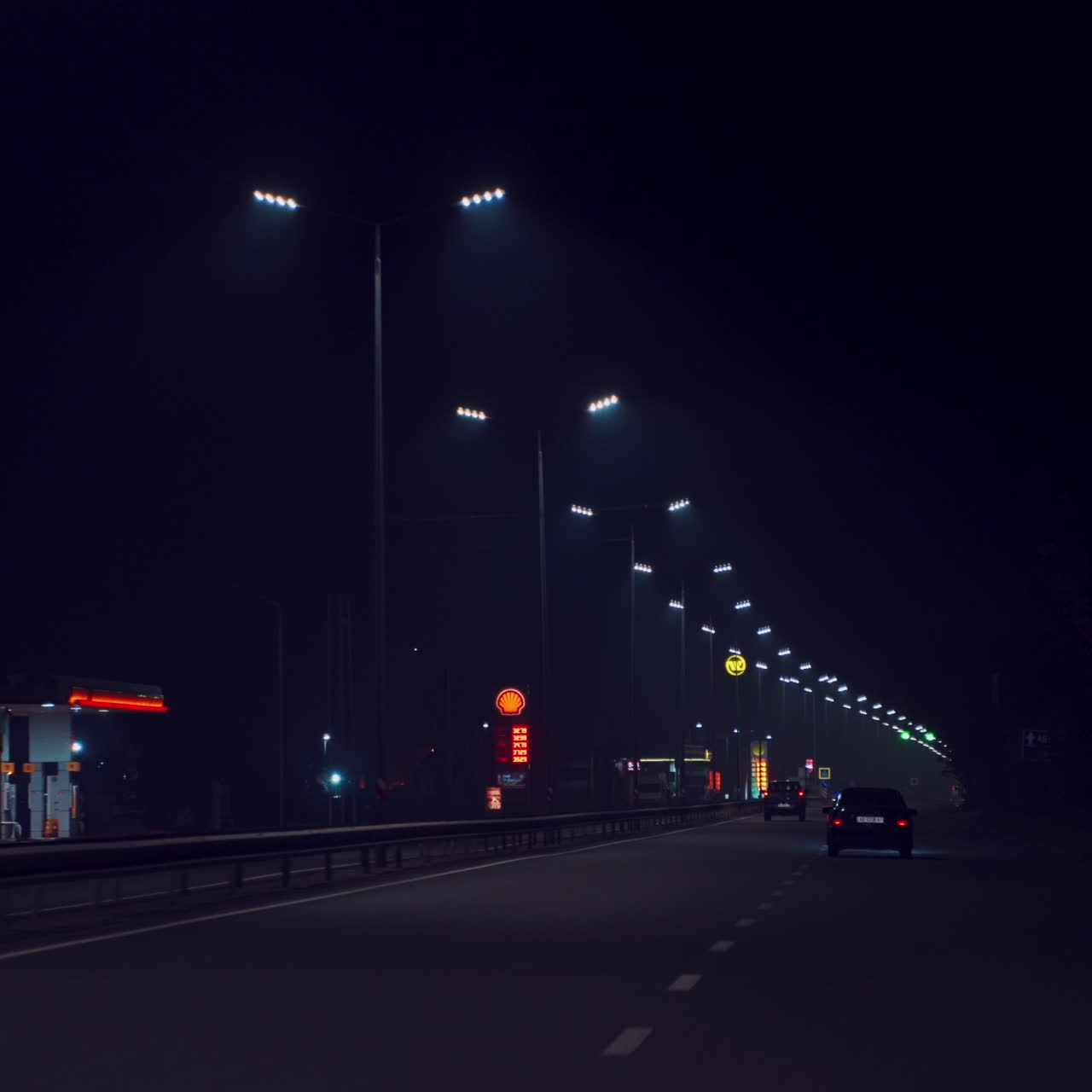 driving on the night highway. Cars are driving on the way to home in the evening