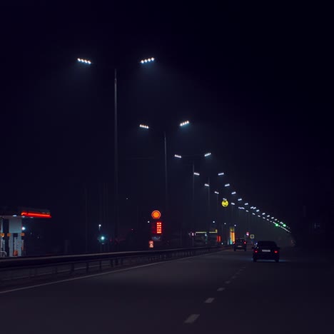 driving on the night highway. cars are driving on the way to home in the evening