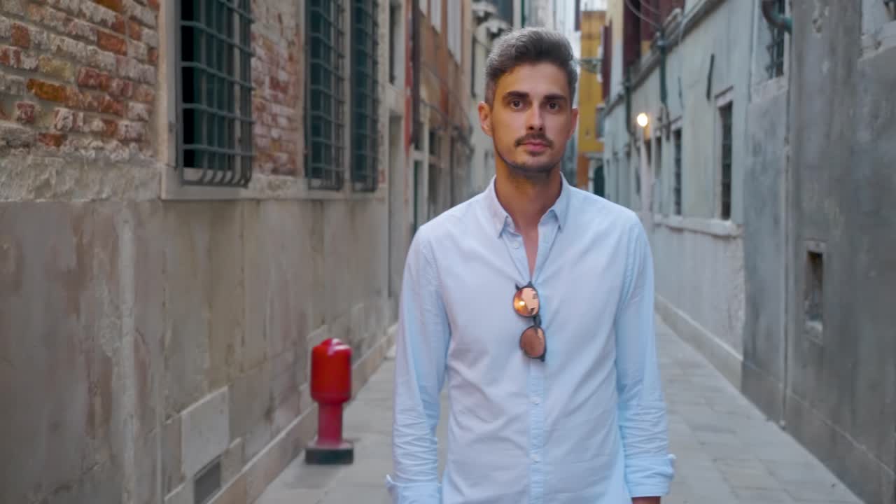 Man Standing in a Narrow Urban Alleyway