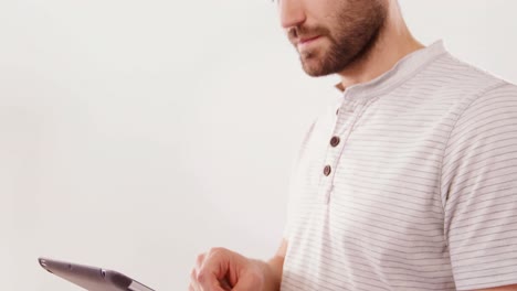 Handsome man using digital tablet