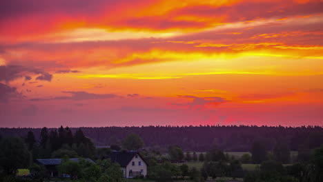 time lapse of purple sky and dawn above countryside village just before sunrise