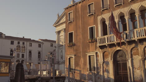 Revealing-shot-of-Chiesa-di-San-Stae-in-golden-morning-light,-Venice,-Italy