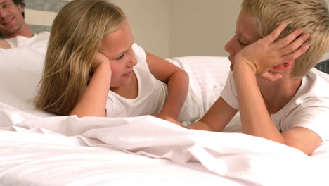 Cute-family-resting-in-their-bed