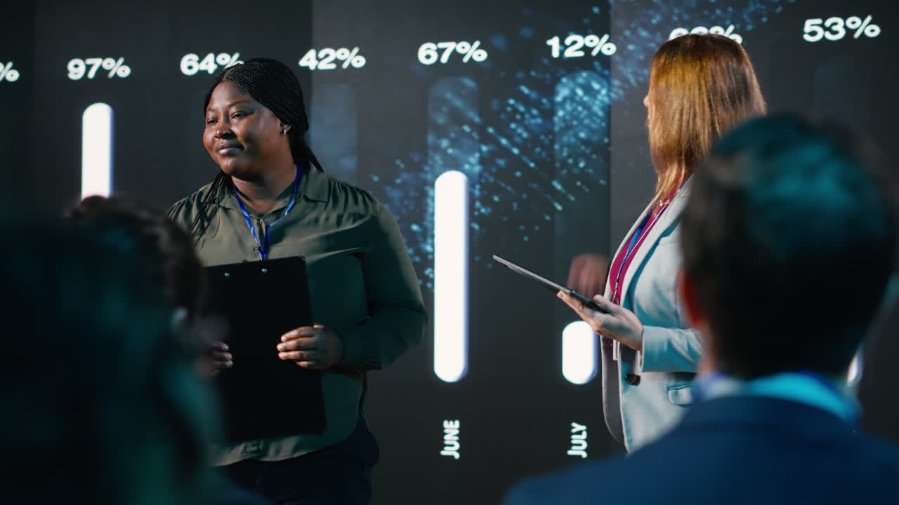 Diverse team of female presenters hosting a business conference