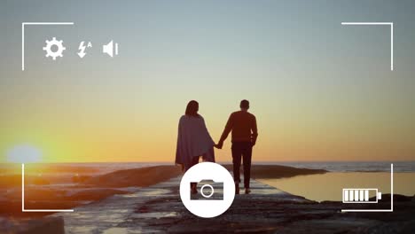 tomando fotos de una pareja con una cámara digital