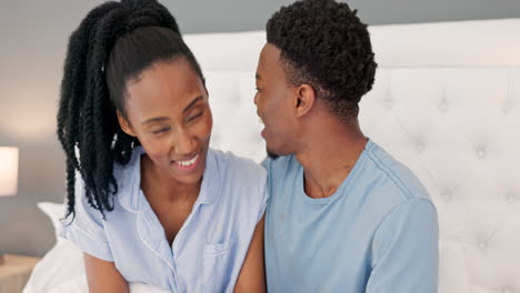 Love,-kiss-and-couple-in-bedroom-with-tablet