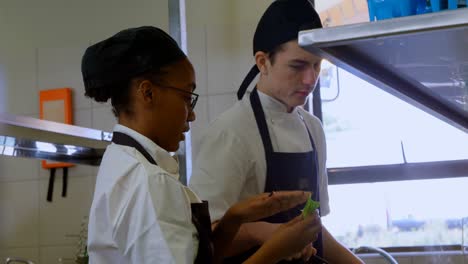 Chef-talking-to-each-other-in-kitchen-4k