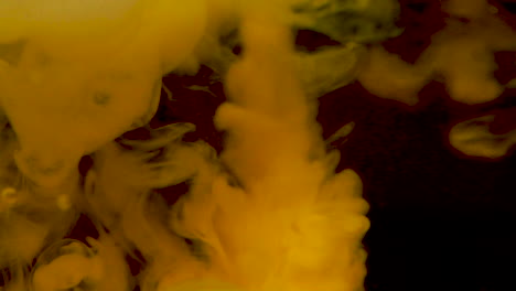 Extreme-macro-close-up-of-Milk-Pouring-Into-Tea-In-A-Glass