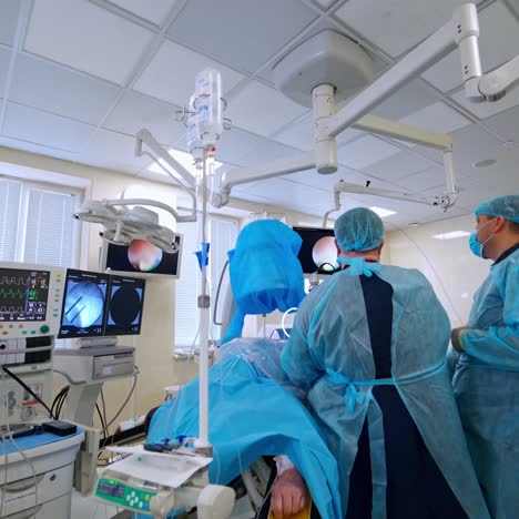 surgeons performing operation in clinic