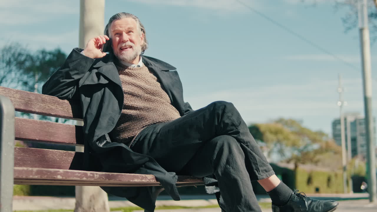 Stylish Man Talking on Cell Phone in Park