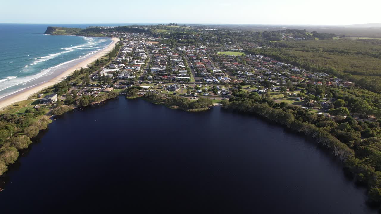 Aerial View Of Lake Ainsworth - Freshwater Tea Tree Lake With Dark Tannins In Lennox Head, New South Wales, Australia. pullback shot