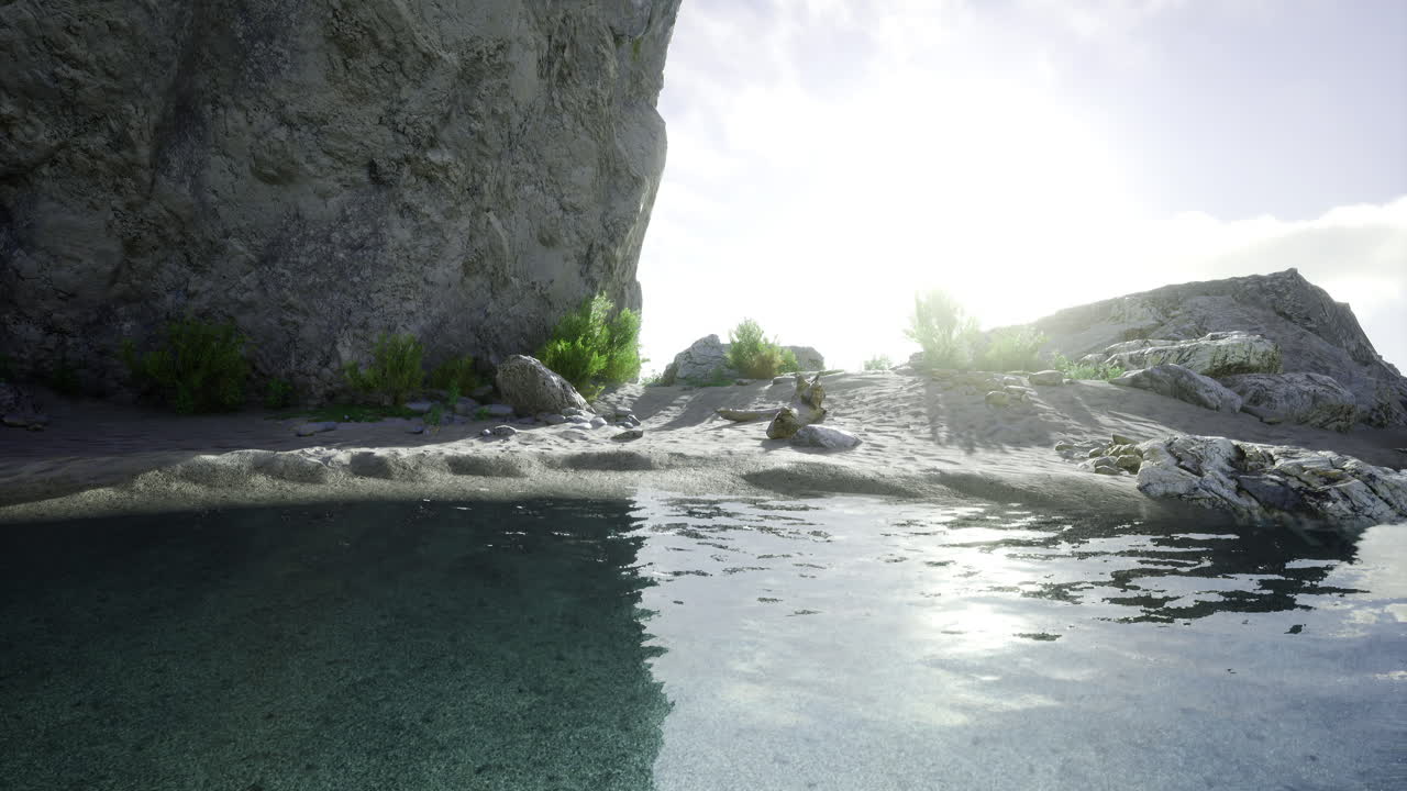 Sunlight glimmers over tranquil waters near rocky shore at dawn