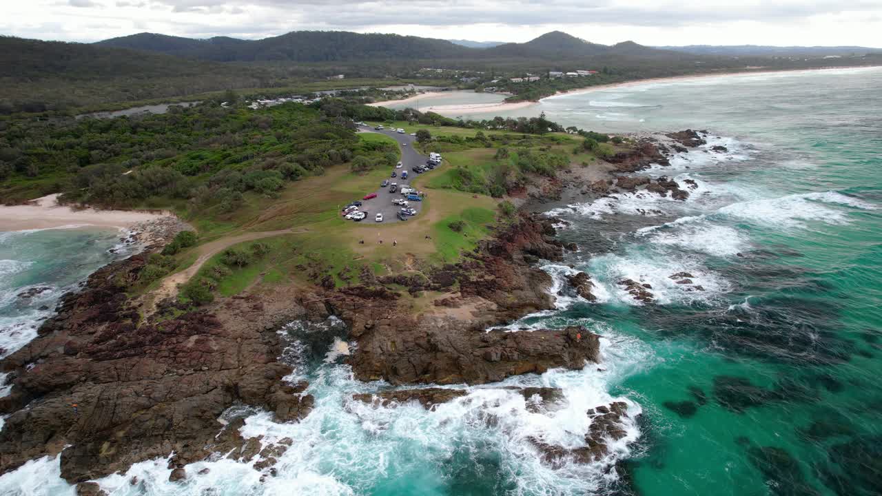 Hastings Point Lookout With Waves Splashing On The Shore In NSW, Australia - Drone Shot