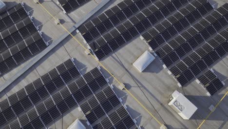 Aerial-flyover-rooftop-installed-with-many-modern-solar-panels