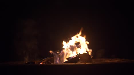 fire pit slow motion night medium shot